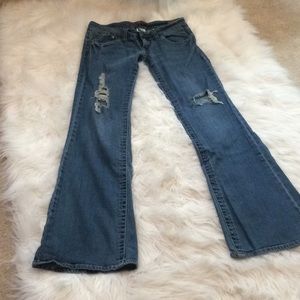 Hydraulic distressed boot cut jeans